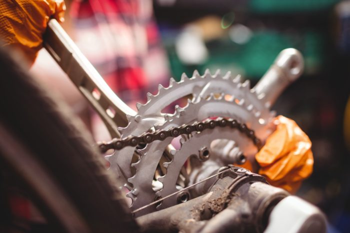mechanic-repairing-bicycle